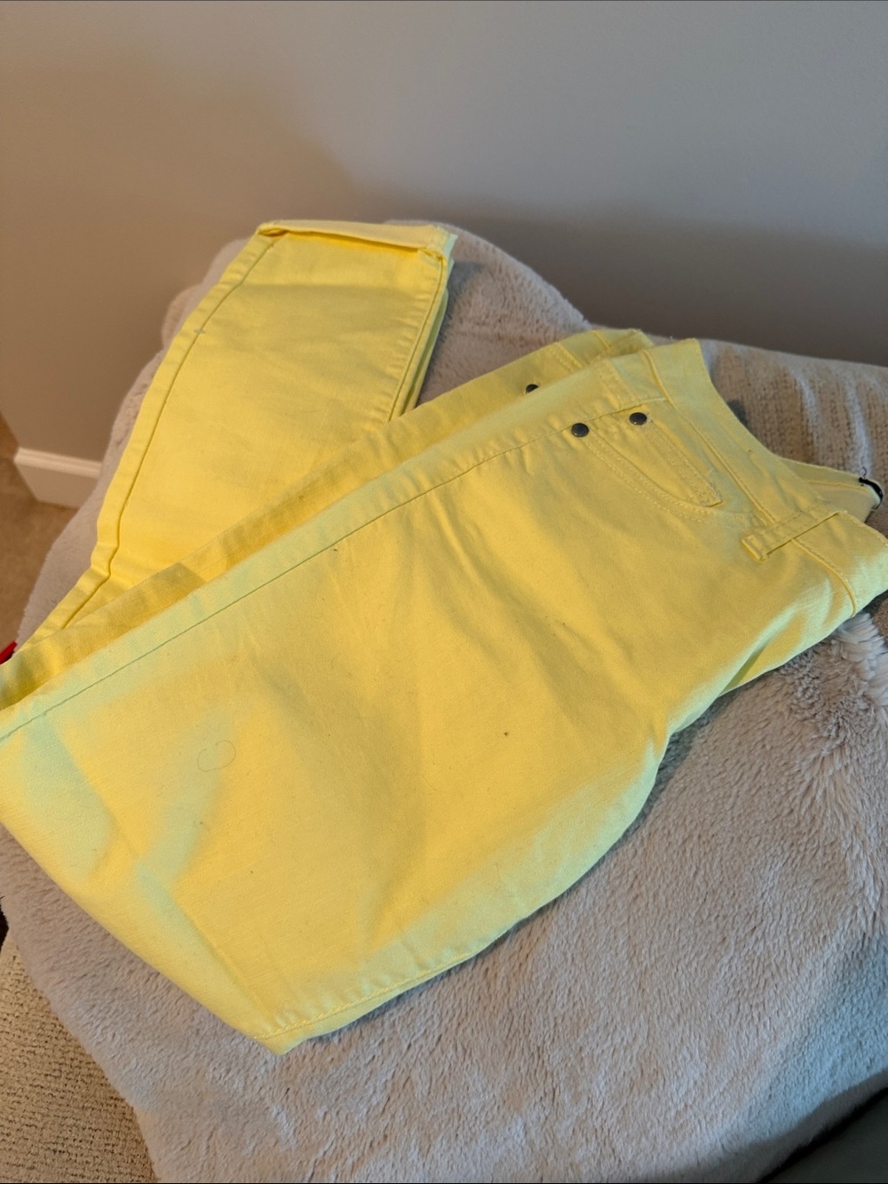 Pale yellow skinny jeans
